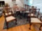 Claw footed Chippendale style dining table w/ (8) chairs, two extra leaves.