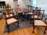 Claw footed Chippendale style dining table w/ (8) chairs, two extra leaves.