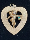 14K Gold heart & Cupid charm, 14.7 grams.