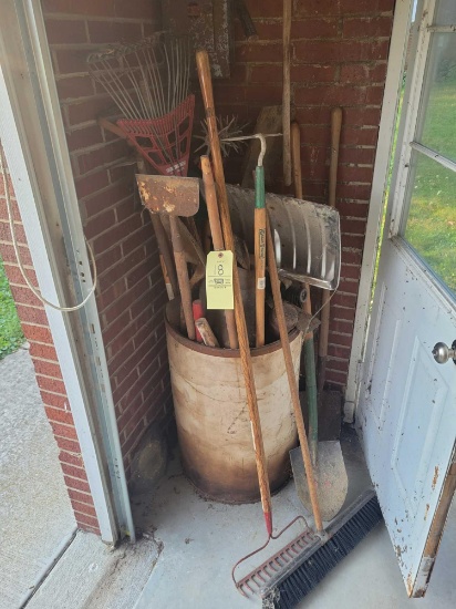 Barrel of yard tools