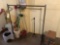 Clothes rack, brooms and bird feeder