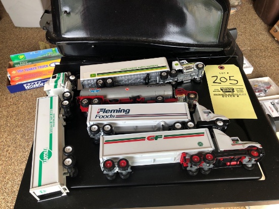 4 winross and 1 Amoco tractor trailers with boxes