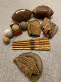 Vintage footballs, baseball gloves, mini baseball bats, & balls