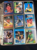 Binder of assorted baseball cards, Jose Canseco, Roger Clemens, Will Clark