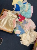 Box of vintage doll clothing