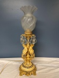 Metal cherub lamp with glass prism
