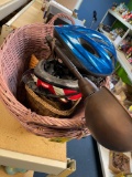 Two wicker baskets, two bicycle helmets, metal lamp