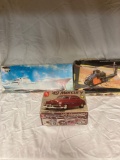 Three model kits- ship, car, helicopter