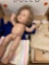 Two old dolls and some clothing/miscellaneous