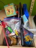 Box of toys, play guns, books, Billy Ray Cyrus tour bus, Kellogg?s diecast cars