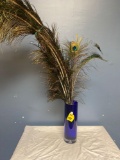 Blue vase with peacock feathers