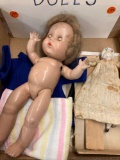 Two old dolls and some clothing/miscellaneous