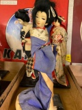 Six Japanese geisha dolls 14 inches to 18 inches tall