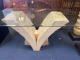 Large glass top table with plaster bottom 62 inches by 35 inches