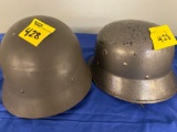 2 military helmets