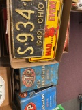 Old license plates and 2 oil cans