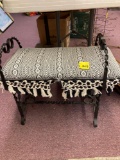 Cast iron stool with upholstered seat