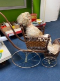 Antique doll carriage and old doll