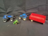 New Holland tractors and red wagon