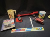 Assorted toys, metal wheelbarrow, Bambie watch, Garfield ruler