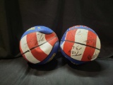 Pair of autographed Harlem Globetrotters basketballs with player signatures, no COA with signature