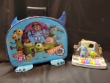 Monster Inc. kid's luggage bag and monsters scream factory piano