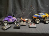 3 rc cars with miscellaneous remotes