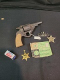 Wood pistol prop, advertising badges, caps