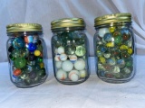 (3) Jars marbles (cat eyes & slag shooters).
