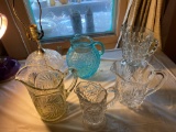 (5) Glass pitchers, glass table lamp.