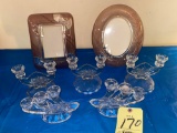 (2) Glass picture frames, glass candle holders.
