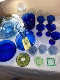 Wexford canisters, blue glassware, green ashtrays.