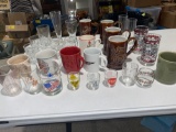Coffee cups, water glasses, shots.