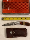 Unmarked folding knife w/ leather sheath, MIB.