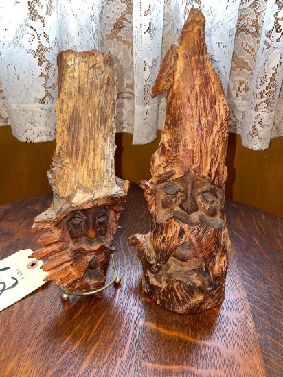 2 wood carved faces