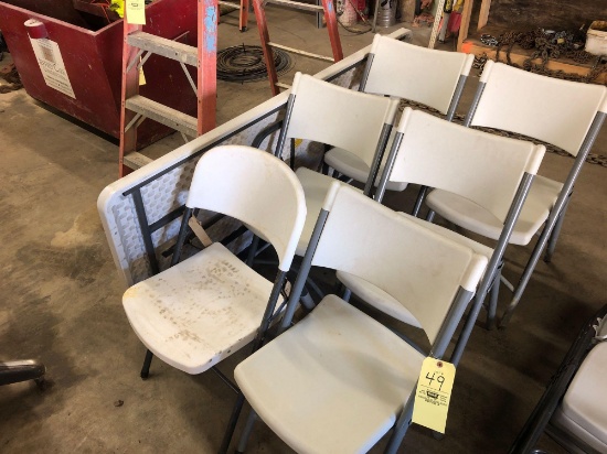 6 plastic folding chairs and 6 ft folding table