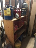 Gas cans, desk chair and wood shelf