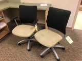 Pair of office desk chairs, one with arm rest