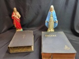 Pair bibles and religious figurines