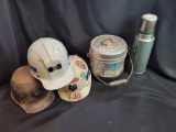 Hardhats, thermos, and lunch pail