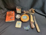 Arvin radio, ashtrays, knives, hand plane, military patch and book