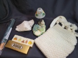 Umbrella, village house, candle holder, shell, knitted purse