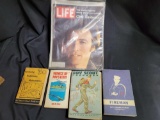 Life magazine with Clint Eastwood, Boy Scout handbook, Navy training book