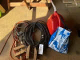 Extension cord, clamps, fuel can