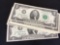 Fourteen two dollar bills with sequential serial numbers