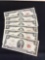 Six red seal two dollar notes with sequential serial numbers