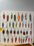 poster board full of fishing lures