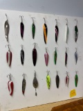 Poster board full of fishing lures