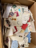 Box of vintage postage stamps