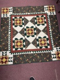 Square handmade machine quilted quilt with wall hanging tabs